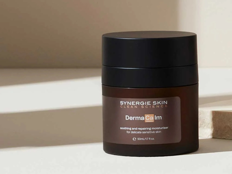 ynergie Skin DermaCalm moisturiser jar on a neutral-toned bench
