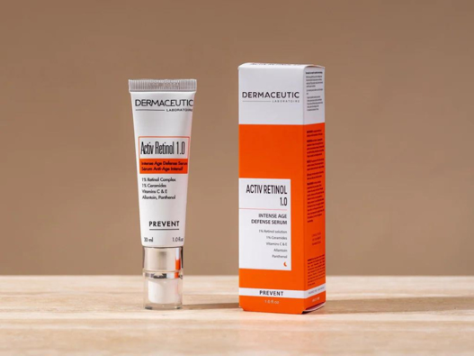Flat lay of skincare ingredients like vitamin C serum, niacinamide, and hyaluronic acid dropper bottles.